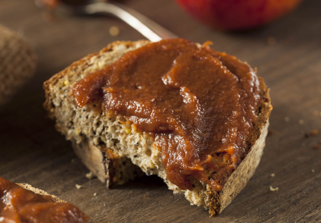 Homemade Amish Apple Butter spread on a piece of sourdough bread
