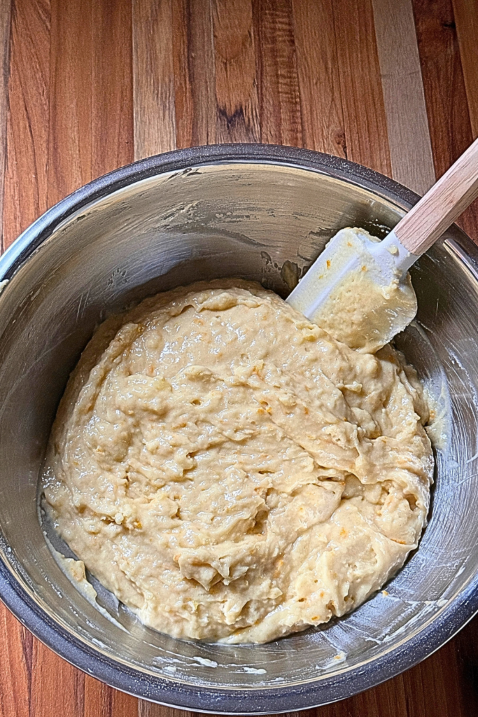 Cranberry orange bread batter mixed in a bowl
