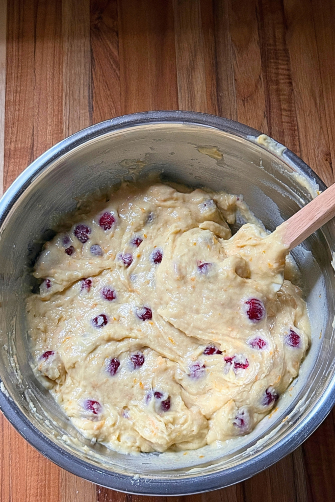 Fresh cranberries folded into orange bread batter
